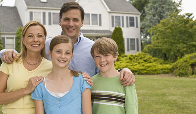 family out side of house