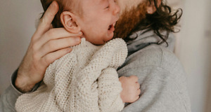 https://unsplash.com/photos/a-man-holding-a-baby-in-his-arms-BgfxafkXjds?utm_content=creditShareLink&utm_medium=referral&utm_source=unsplash