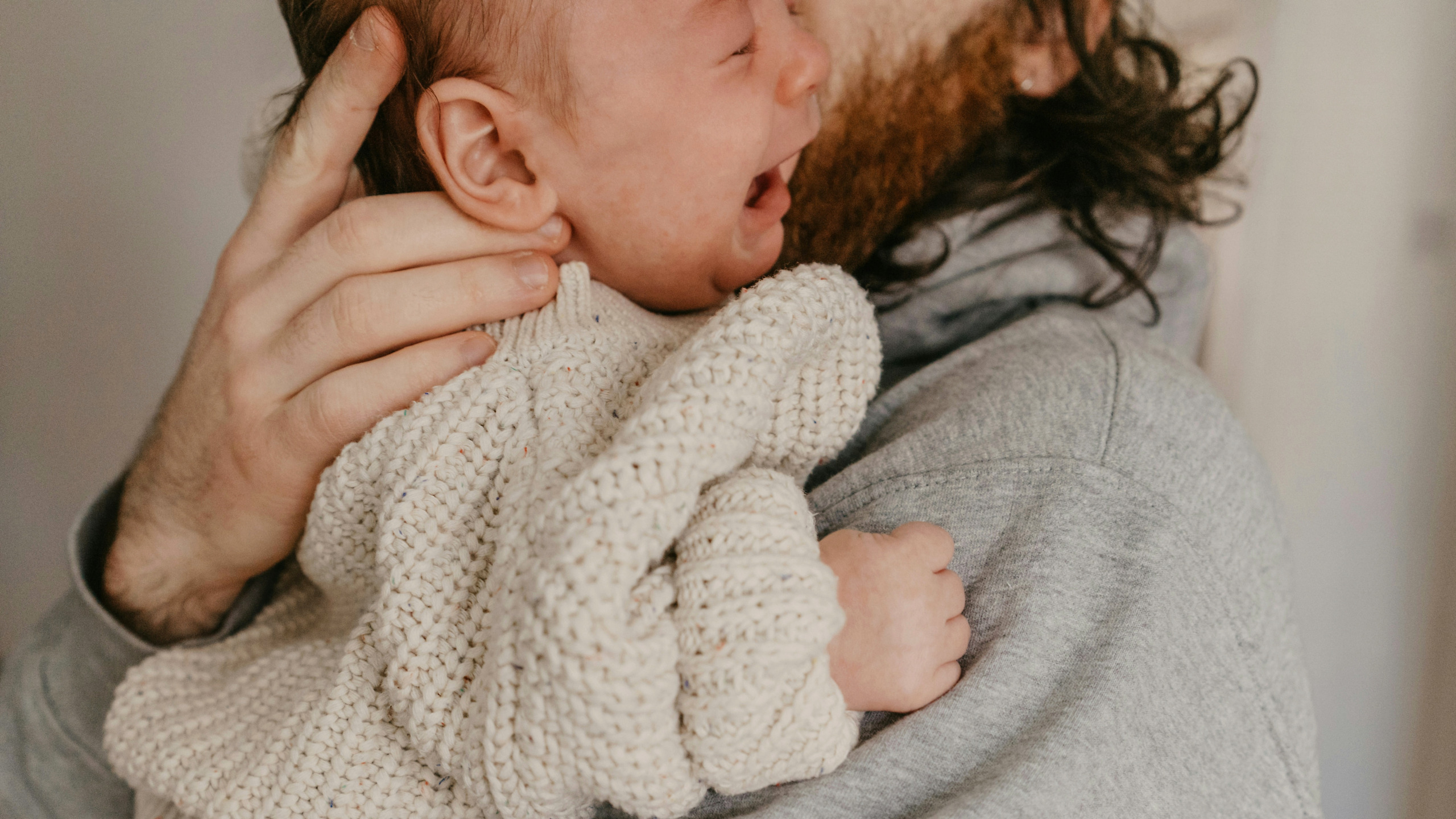 https://unsplash.com/photos/a-man-holding-a-baby-in-his-arms-BgfxafkXjds?utm_content=creditShareLink&utm_medium=referral&utm_source=unsplash